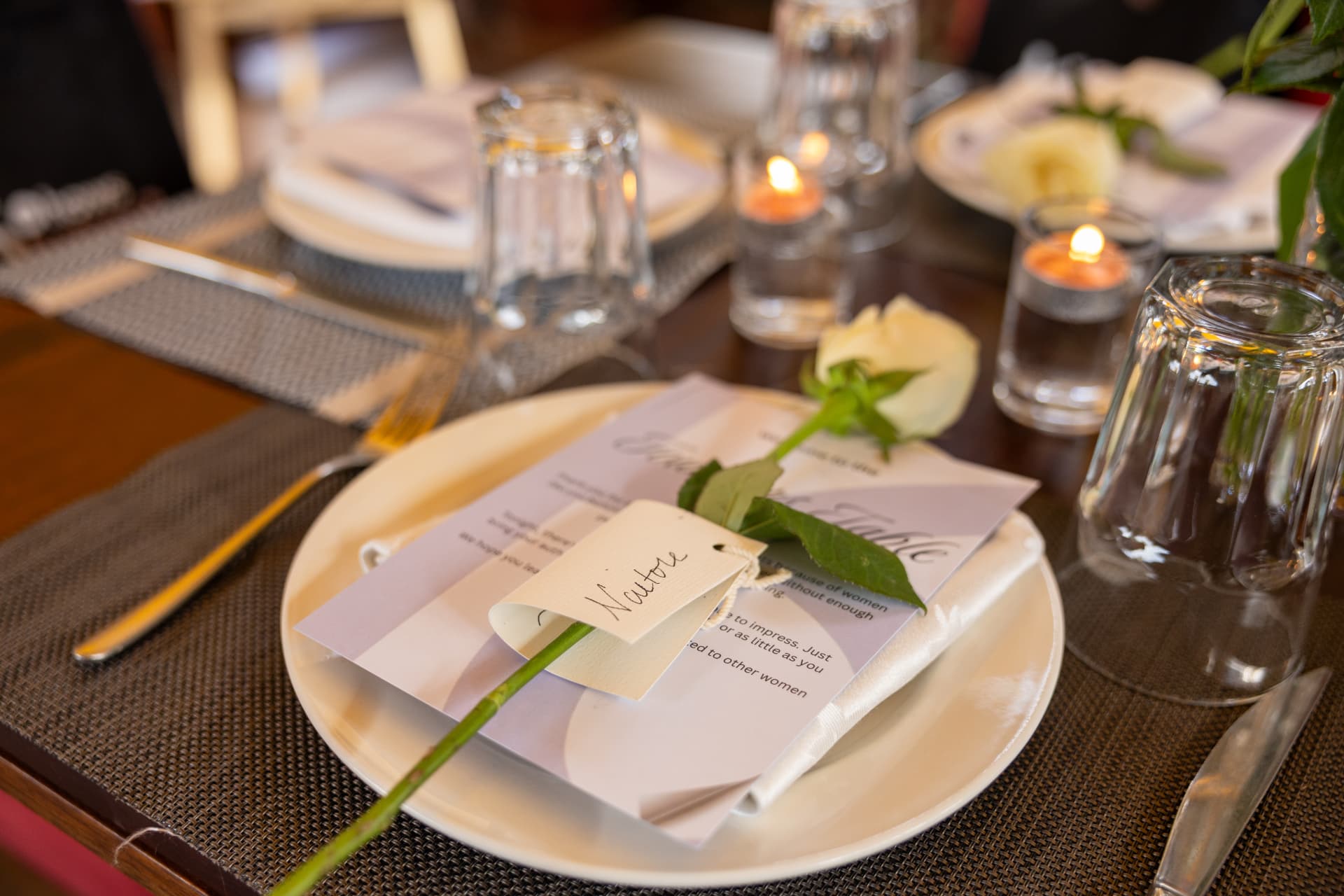 Founders Table menu and name card on a plate